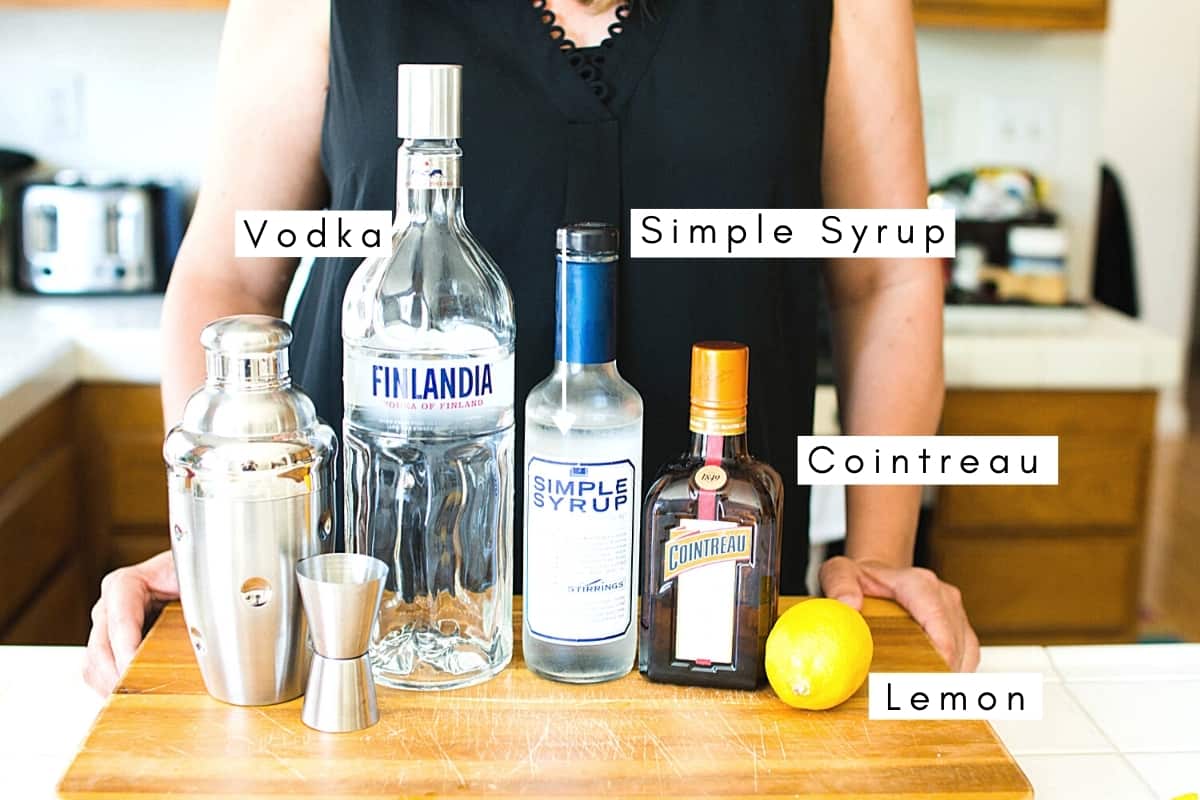 Labeled ingredients to make this lemon drop cocktail on a counter.