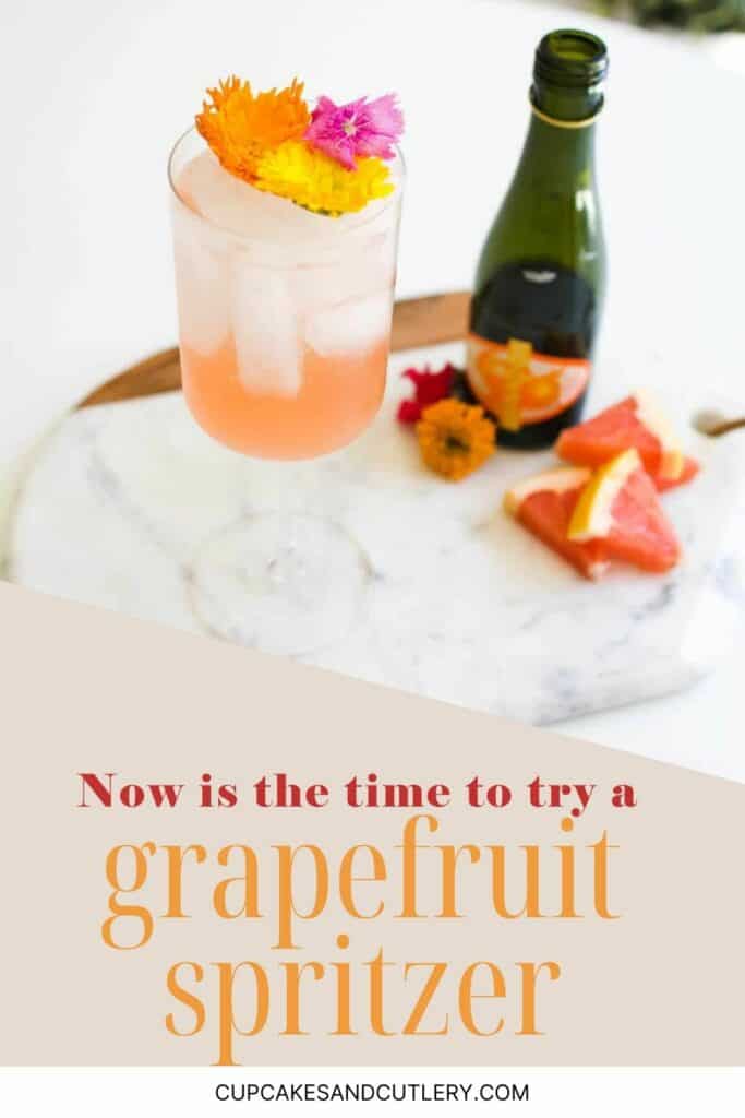 Text: Now is the time to try a Grapefruit Spritzer with a wine glass holding a cocktail garnished with flowers next to a small bottle of Chandon Garden Spritz.