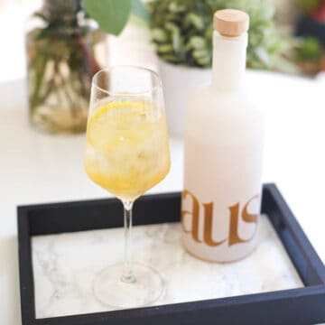 glass of haus spritzer on a serving tray