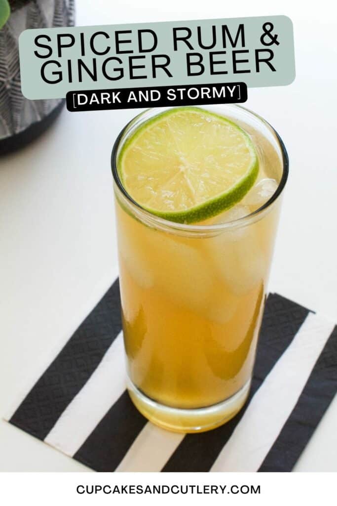 Text - Spiced Rum and Ginger Beer Dark and Stormy with a high ball glass holding a cocktail with a lime wheel garnish.