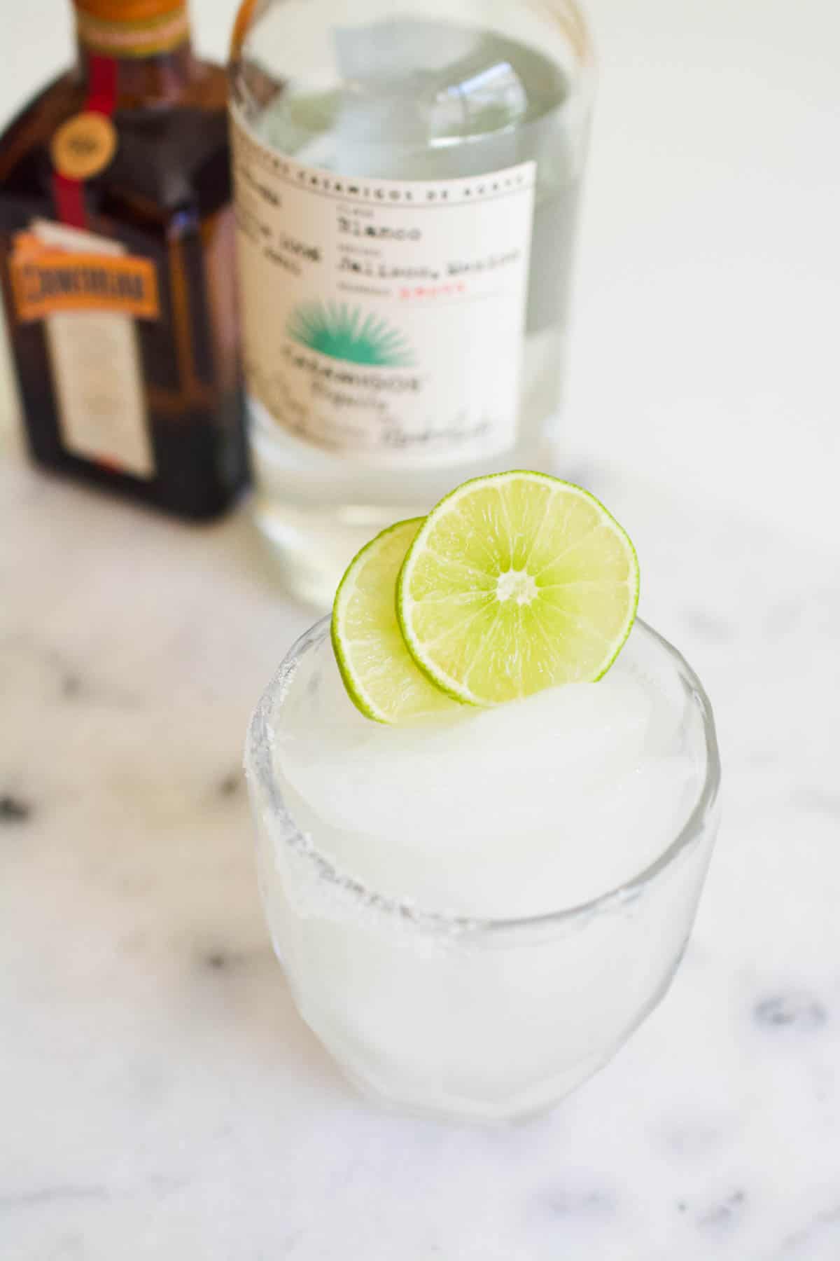 Classic Margarita on the rocks served in a cocktail glass on ice.