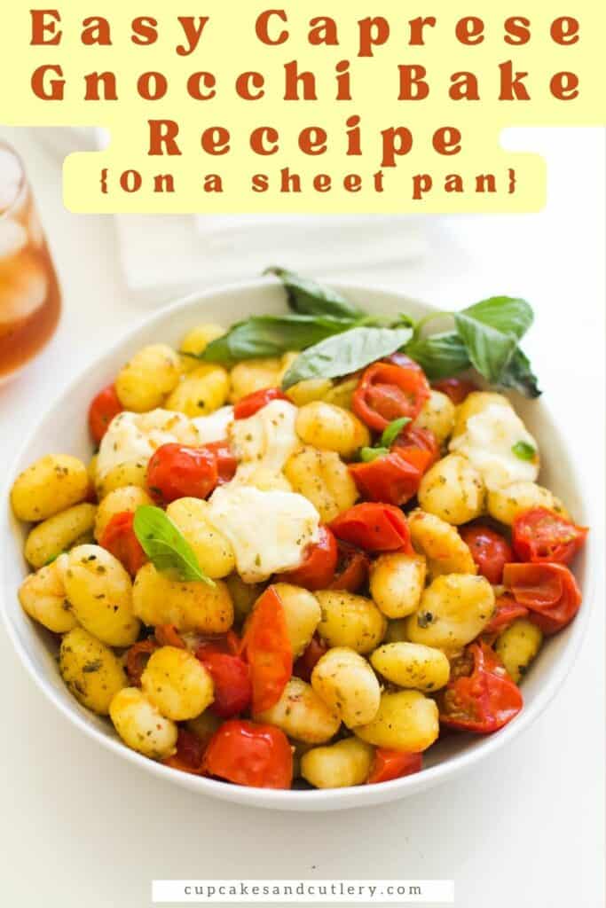 Text - Easy Caprese Gnocchi Bake Recipe (on a sheet pan) with a bowl of gnocchi with cherry tomatoes, mozzarella and fresh basil.