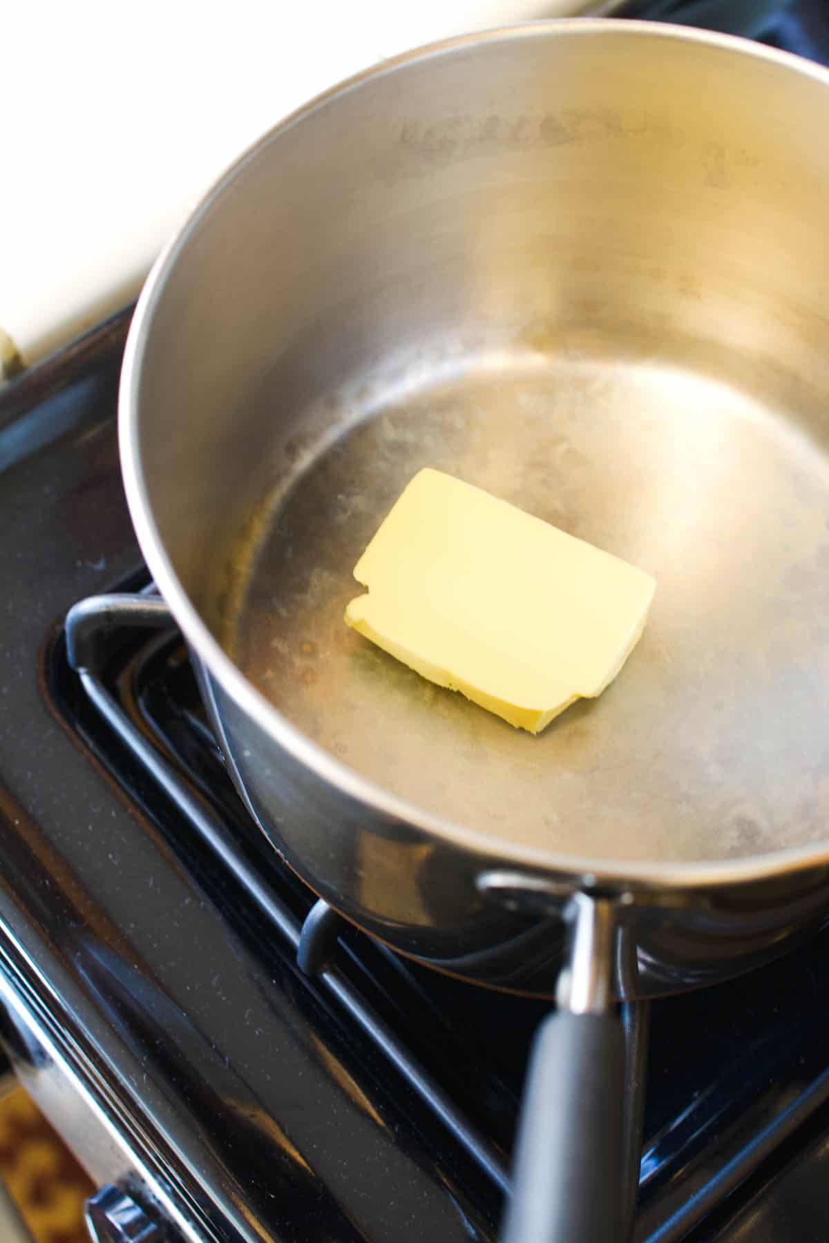 Butter in a saucepan on the stove.