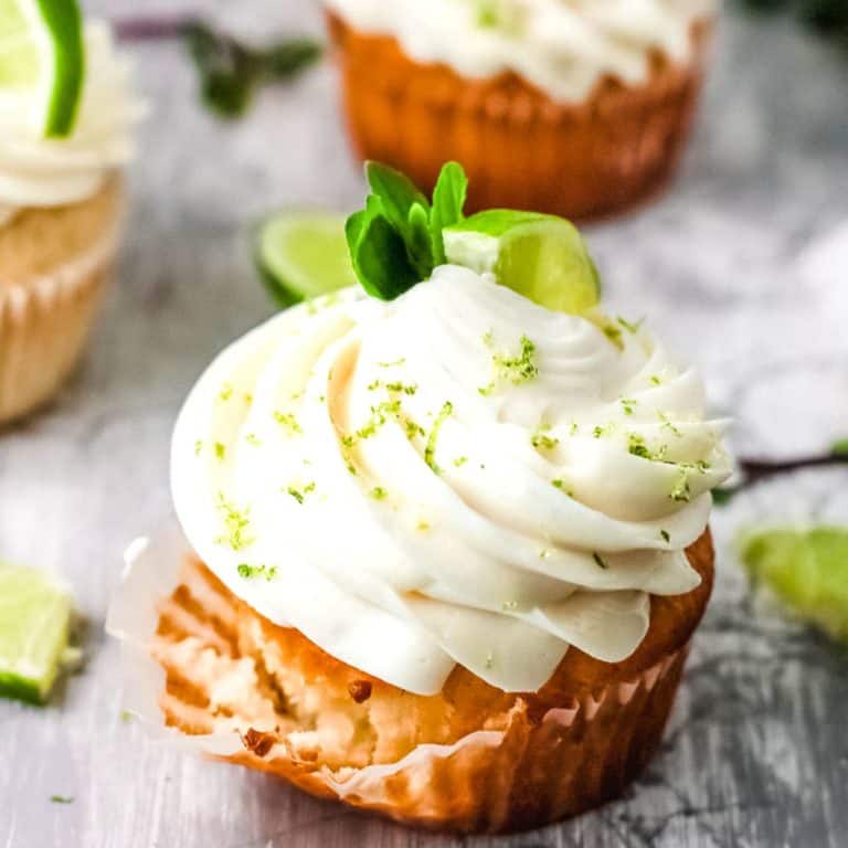 Close up of a cupcake being taken out of the cupcake liner.