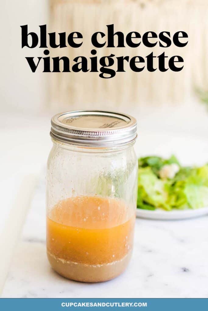 A jar of Blue Cheese Vinaigrette on a counter.