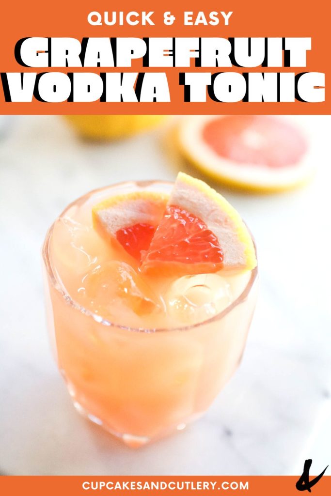 Close up of a cocktail glass holding a Grapefruit Vodka Tonic garnished with grapefruit.