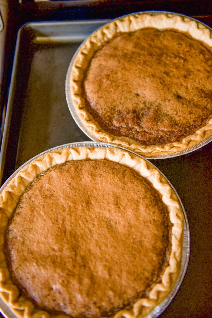 Two baked Brown Sugar Pies on a cookie sheet.