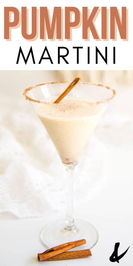 A martini glass with a cinnamon sugar rim full of a pumpkin martini with a cinnamon stick garnish.