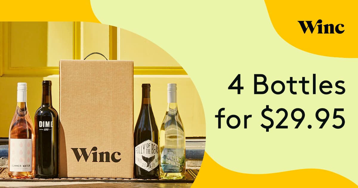 A bottle from Winc Wine club on a table next to 4 bottles of wine and text that says - Winc 4 bottle for $29.95.