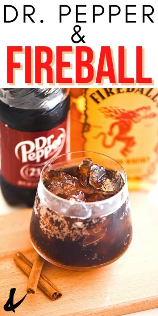 A cocktail glass with a drink in it next to a bottle of Fireball and a bottle of Dr. Pepper.