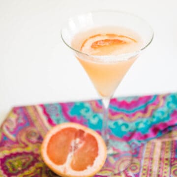 Close up of a martini glass with a grapefruit martini.