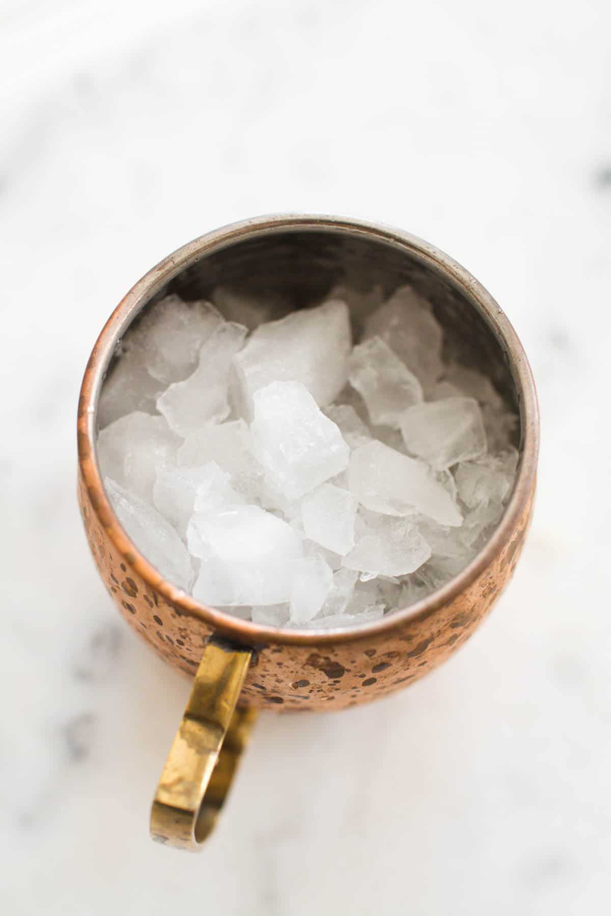 Overhead shot of a copper Mule mug with ice.