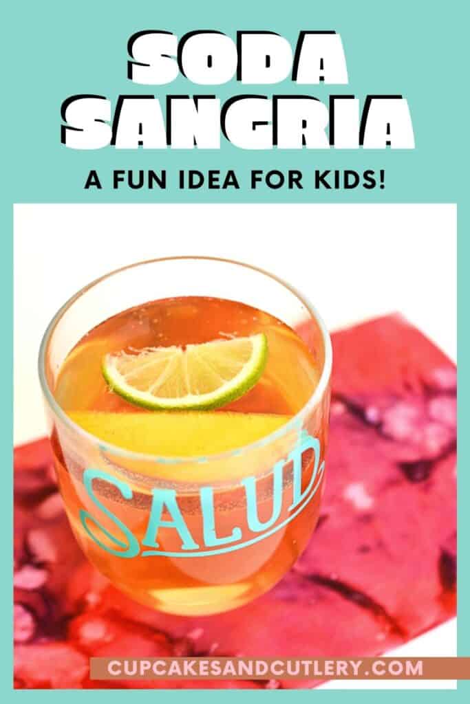 Cup holding kids sangria on a table with text around it.