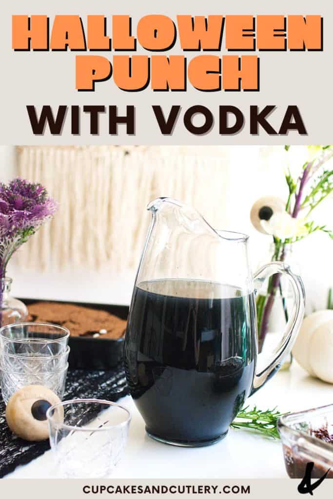 A glass pitcher on a table holding a Halloween punch with alcohol.