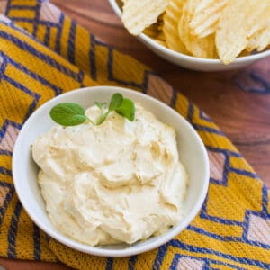 Close up of chip dip in a small white bowl.