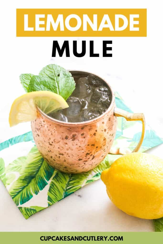 Close up of a lemonade Moscow mule in a mule mug with a lemon next to it.