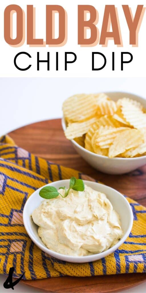 A small white bowl with chip dip next to a bowl of chips.