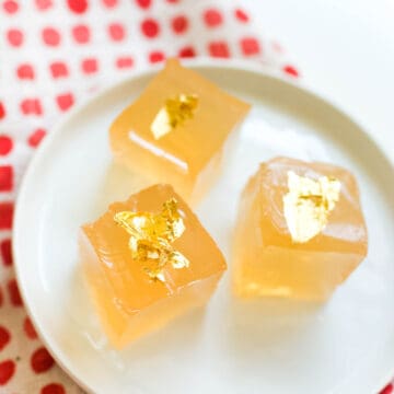 Close up of jello made with white wine on a small dessert plate.