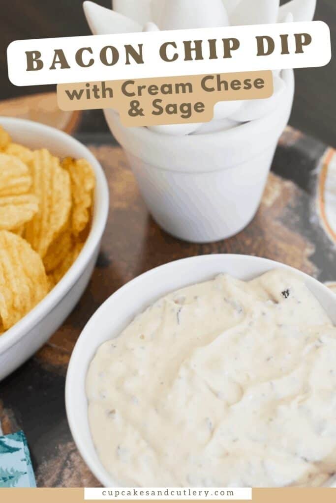 Text - Bacon Chip Dip with cream cheese and sage with a white bowl holding dip on a tray next to a bowl of potato chips and a fake succulent plant.