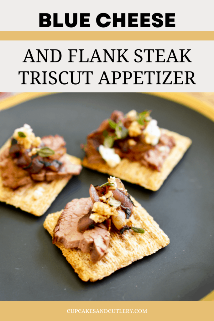 Triscuit crackers on a black plate topped with steak, blue cheese and thyme for an easy steak appetizer.