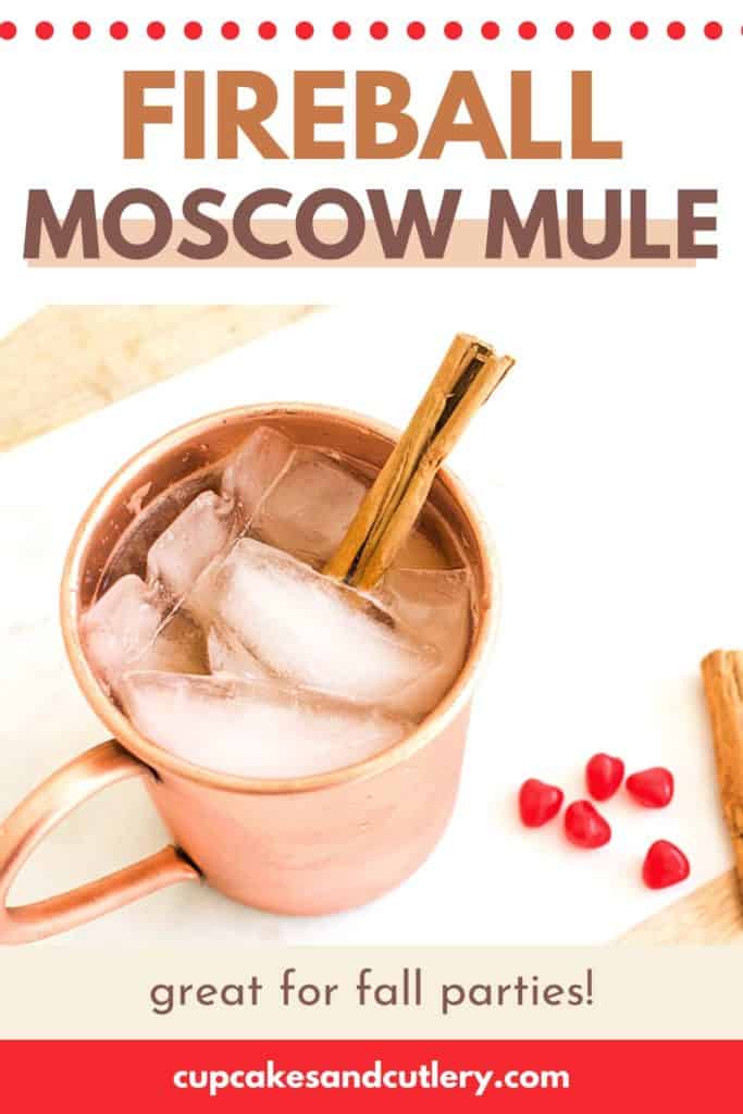 A copper cocktail mug with a Cinnamon Whisky Moscow Mule with a cinnamon stick garnish.