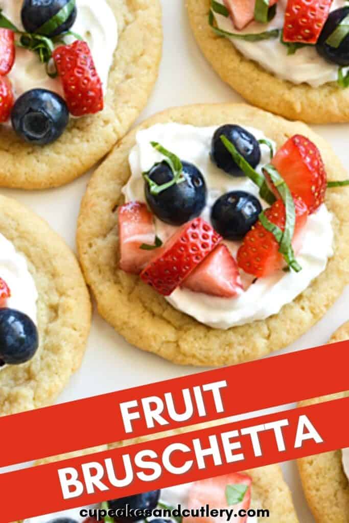 A plate topped with sugar cookies and berries with text around it.