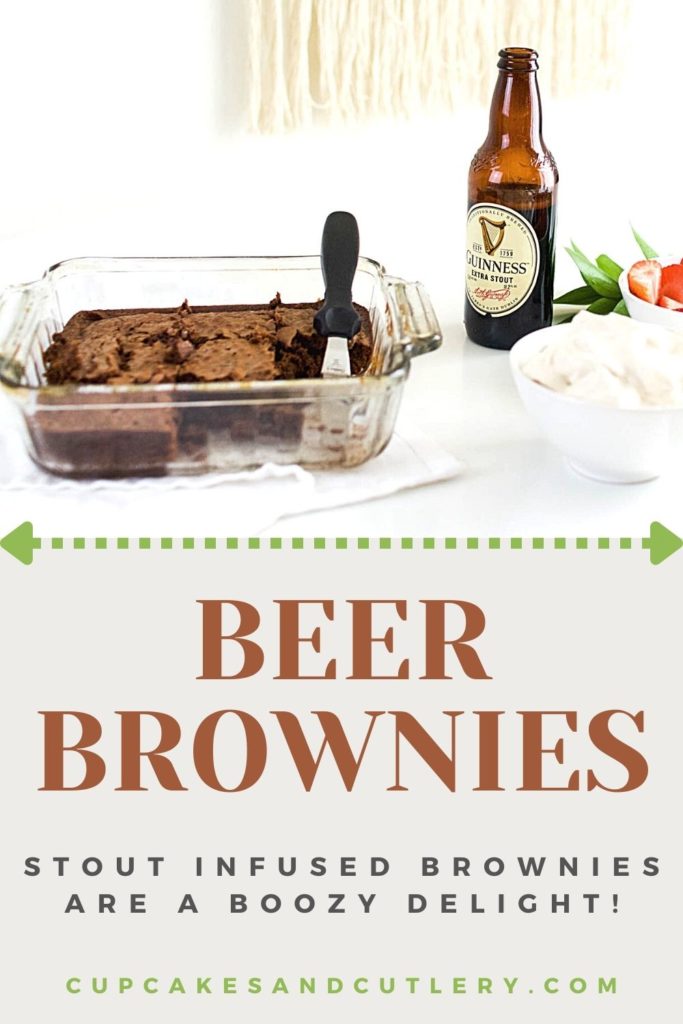 A pan of beer brownies on a table next to a bottle of beer.