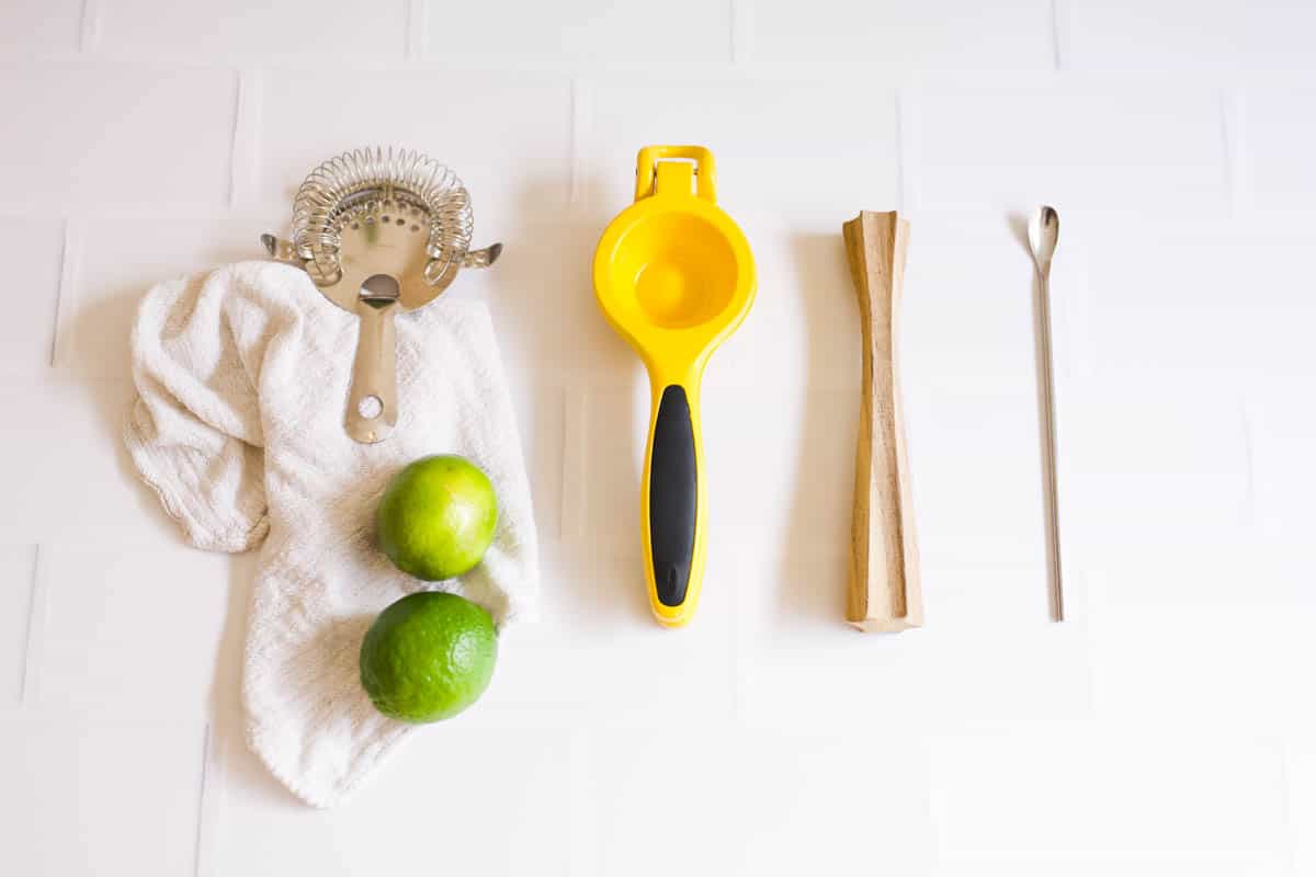 A variety of bar tools on a table.