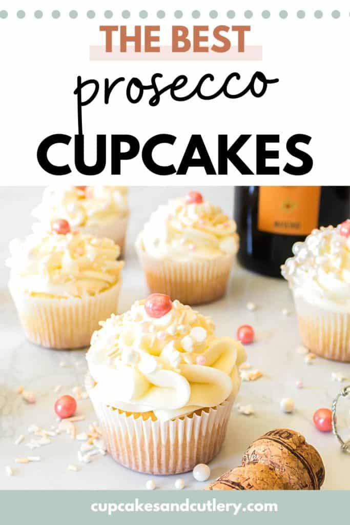 Frosted cupcakes with sprinkles on top on a table next to a bottle of champagne and text- The Best Prosecco Cupcakes, CupcakesandCutlery.com
