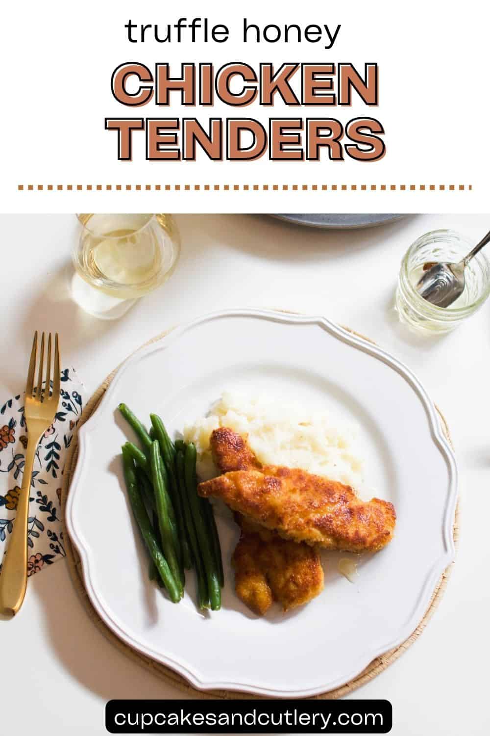 Text: Truffle Honey Chicken Tenders with a white plate holding two chicken tenders drizzled with Truffle Honey next to green beans and mashed potatoes on a dinner table.