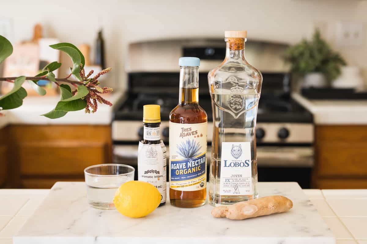 Ingredients to make a lemon tequila cocktail.