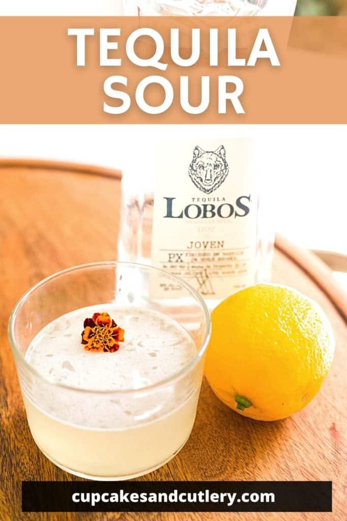 Short cocktail glass on a tray next to a lemon and bottle of tequila with text that says "tequila sour".