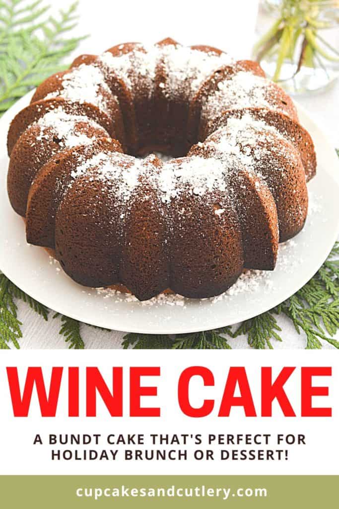 A bundt cake made with wine topped with powdered sugar on a white plate with text: Wine Cake.