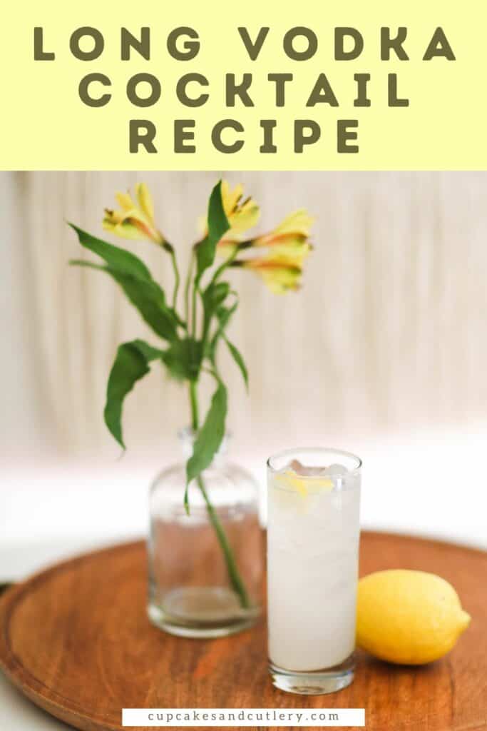 Text - Long Vodka Cocktail Recipe with a wooden tray on a table with a high ball glass and a lemon and flower vase next to it.