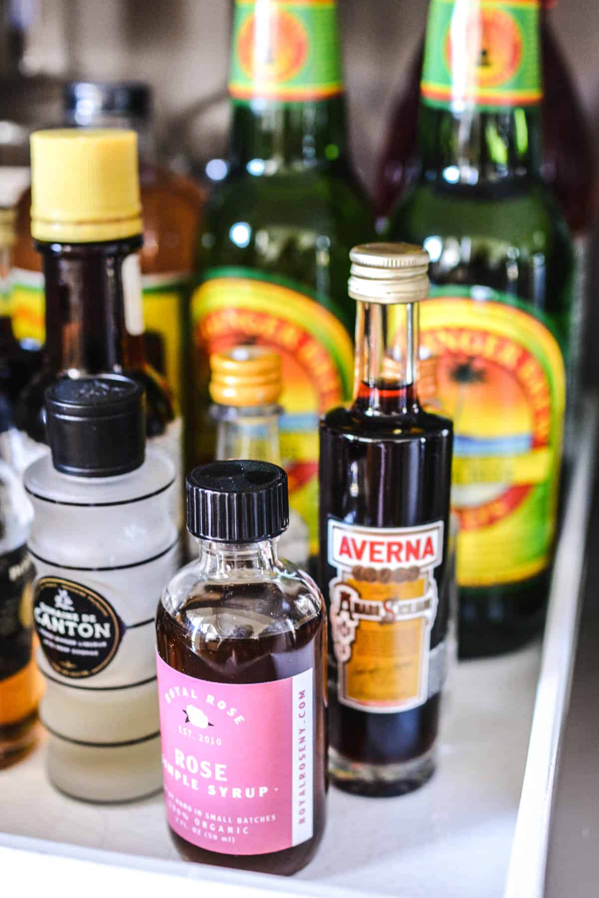 Bottles of small bottles of specialty liquor on a tray.