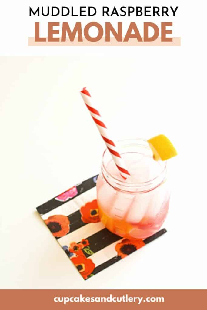 Text - Muddled Raspberry Lemonade with a jar holding a drink with ice and a striped straw.