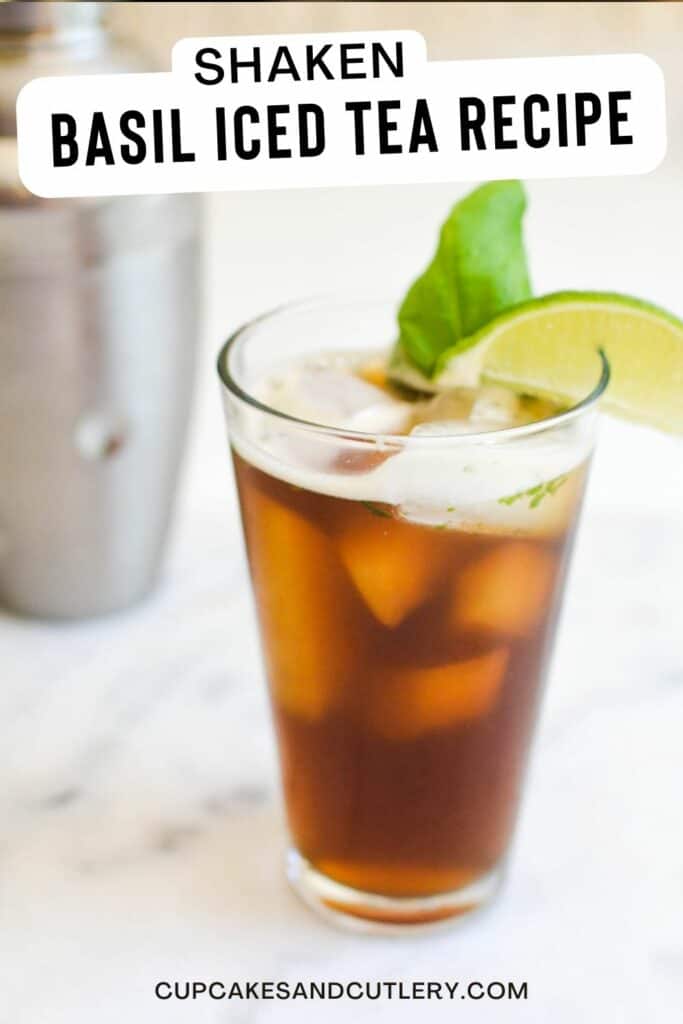 Text: Shaked Basil Iced Tea recipe with a glass full of ice tea garnished with a lime wedge and a basil leaf.