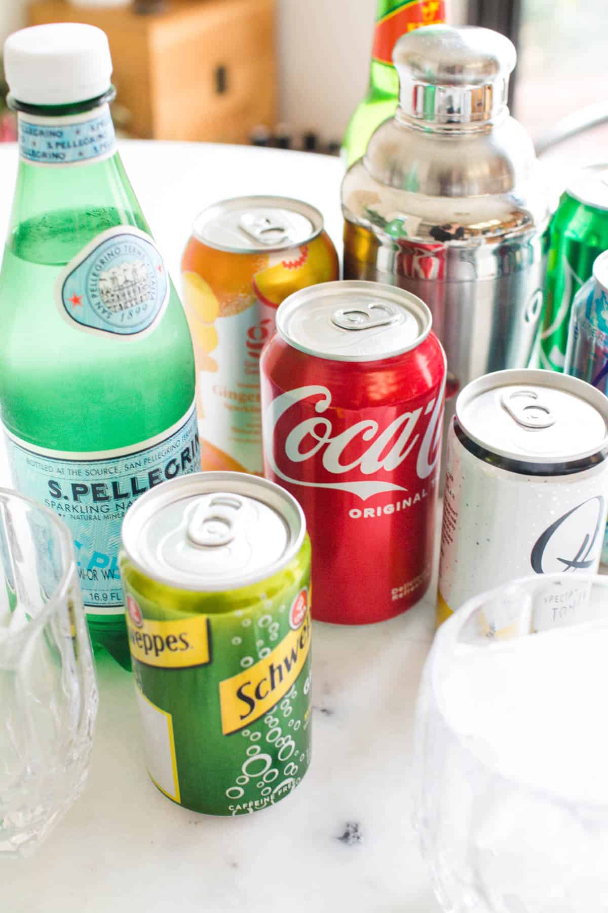 A variety of cans and bottles of things you can use as mixers for cocktails.