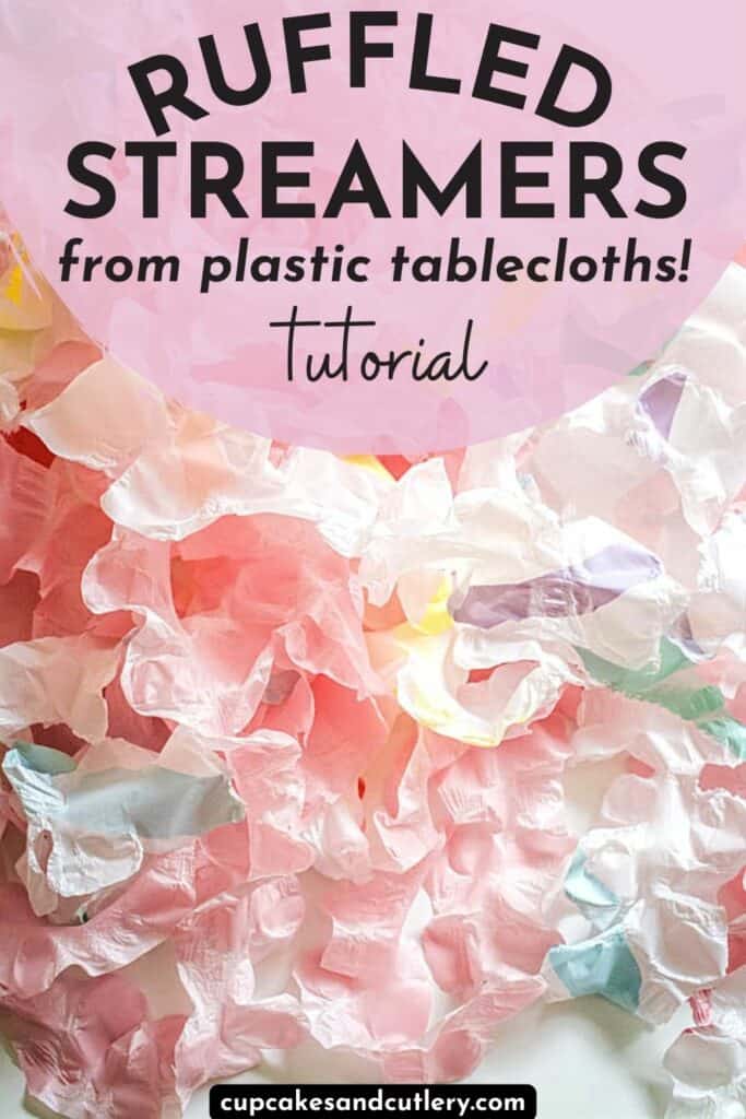 Text - Ruffled Streamers from a plastic tablecloth tutorial over a pile of colorful party streamers on a table.