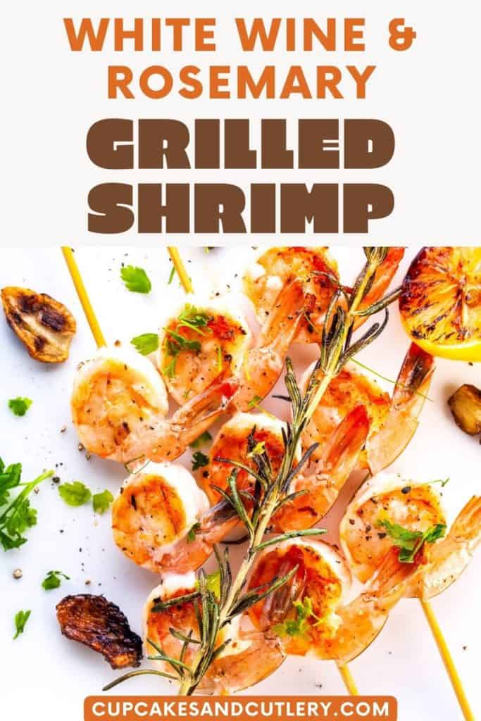 Grilled shrimp on skewers with rosemary with text above it.