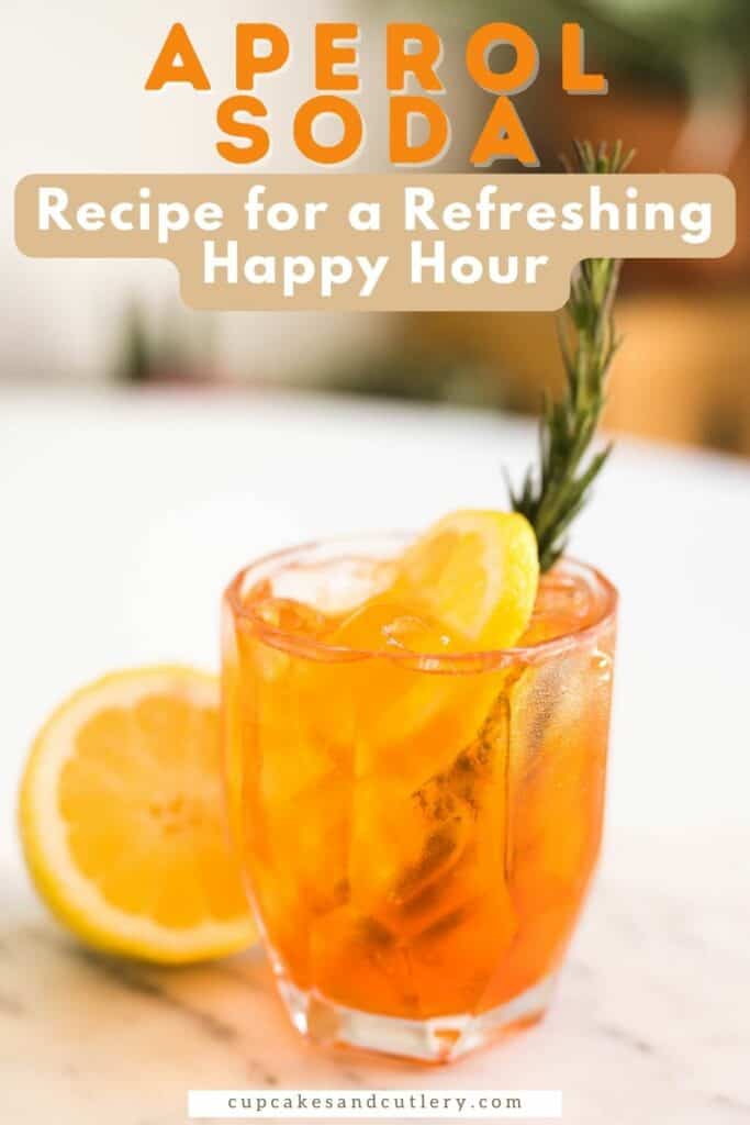 Text: Aperol Soda Recipe for a refreshing happy hour with a short cocktail glass on a table next to half a lemon.