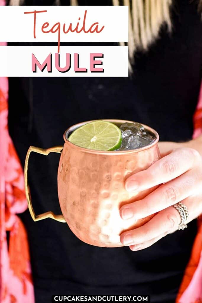 Text - Tequila Mule with a woman holding a copper Moscow Mule mug with ice and a lime wheel.