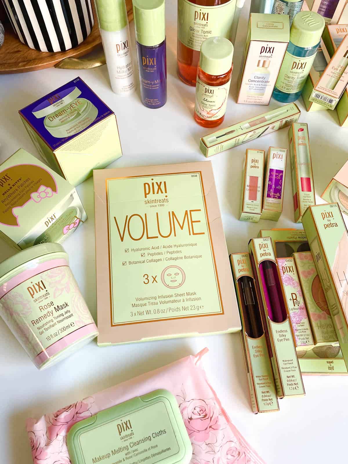 A table full of Pixi Beauty Skintreats and cosmetics. 