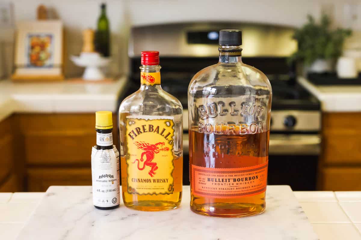 Ingredients to make an Old Fashioned with Fireball Cinnamon Whiskey.