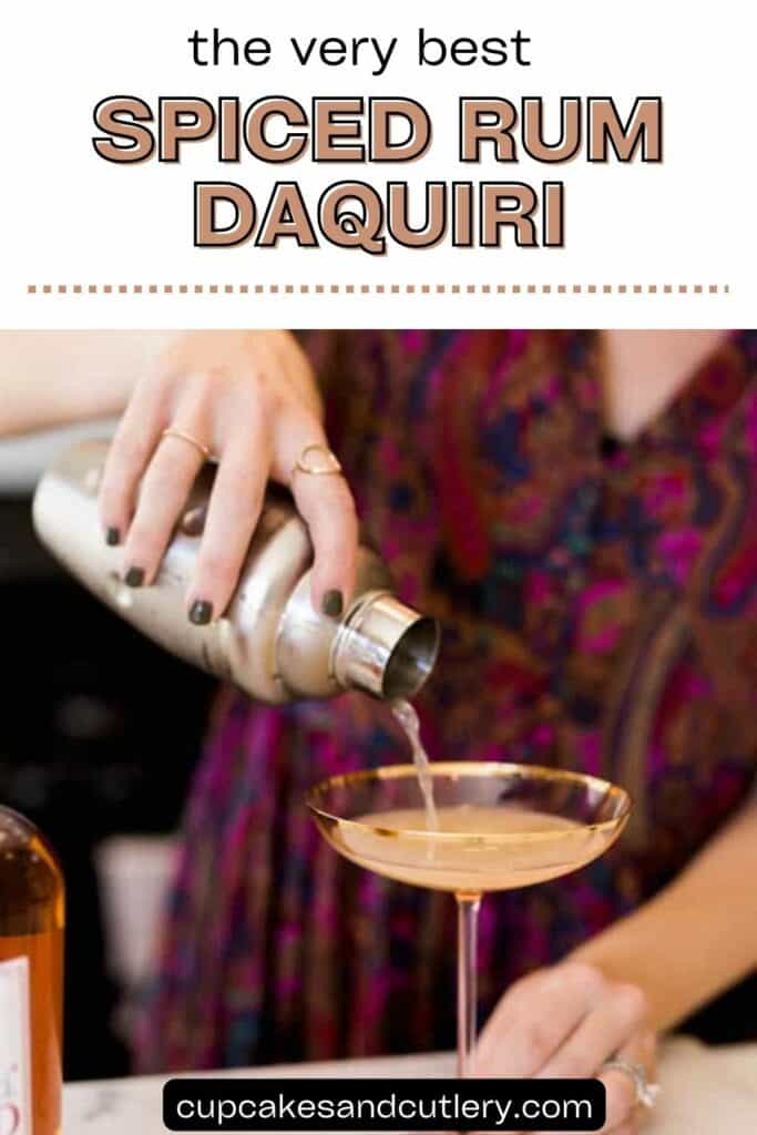Text: The very best spiced rum daiquiri with a woman pouring a cocktail out of a shaker and into a pink coupe glass.