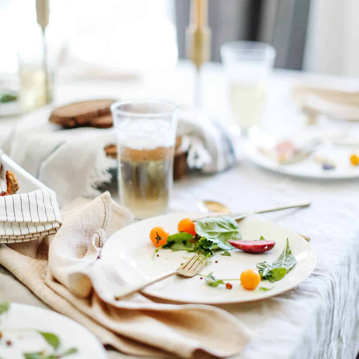 A family dinner table after the meal has ended.