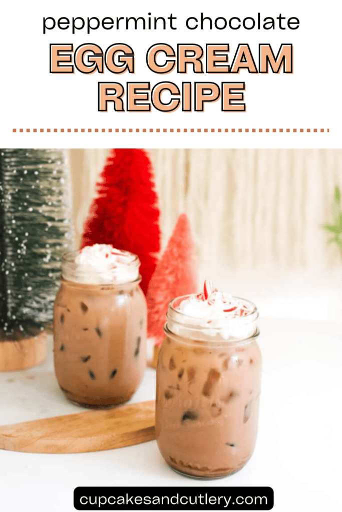 Text: Peppermint Chocolate Egg Cream Recipe with two jars filled with ice and a chocolate soda on a table with christmas tree decorations.