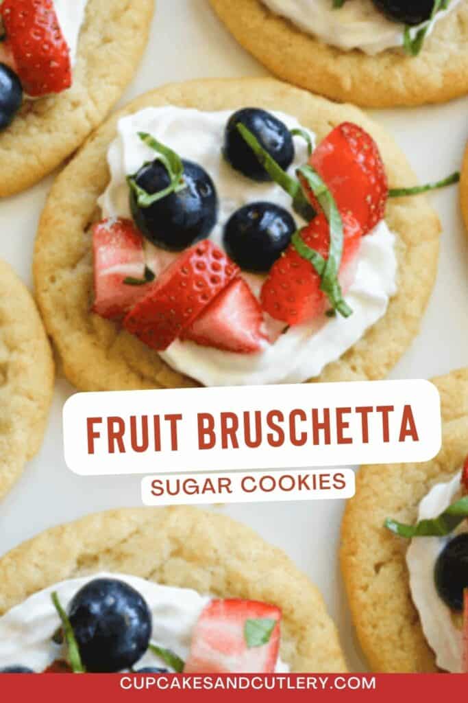 Text - Fruit Bruschetta Sugar Cookies over store-bought sugar cookies topped with whipped cream, fresh berries and basil.