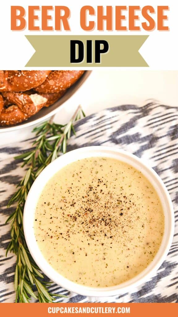 Text: Beer Cheese Dip with a white bowl holding warm dip next to a bowl of pretzels.