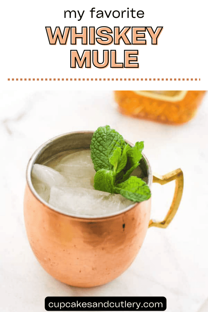 Text: My Favorite Whiskey Mule with a copper mug holding a moscow mule made with whiskey and a mint garnish.